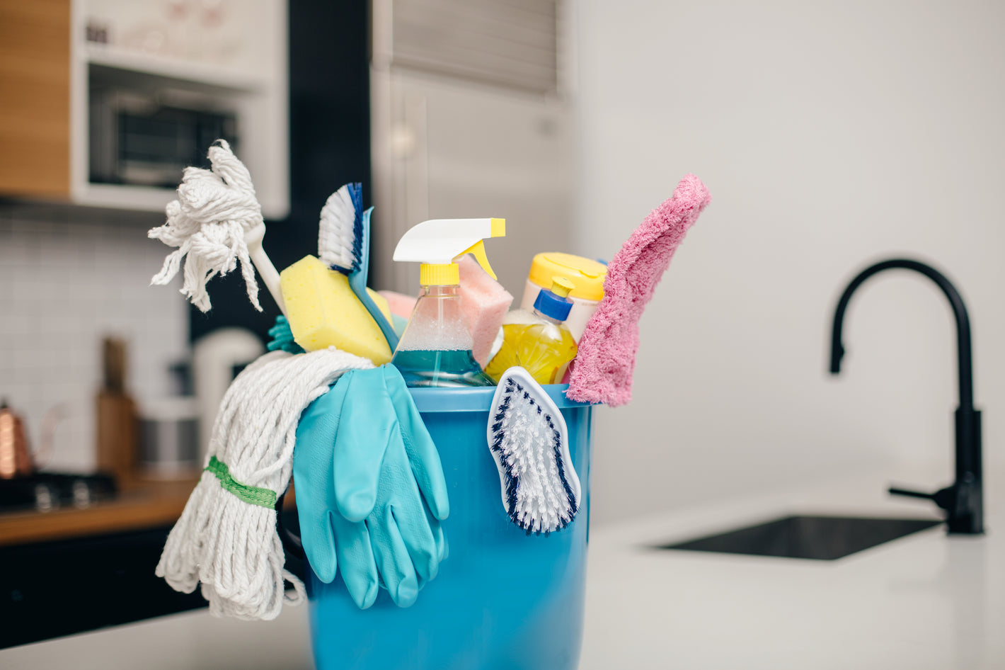 cleaning products in a bucket by allergy asthma clean 